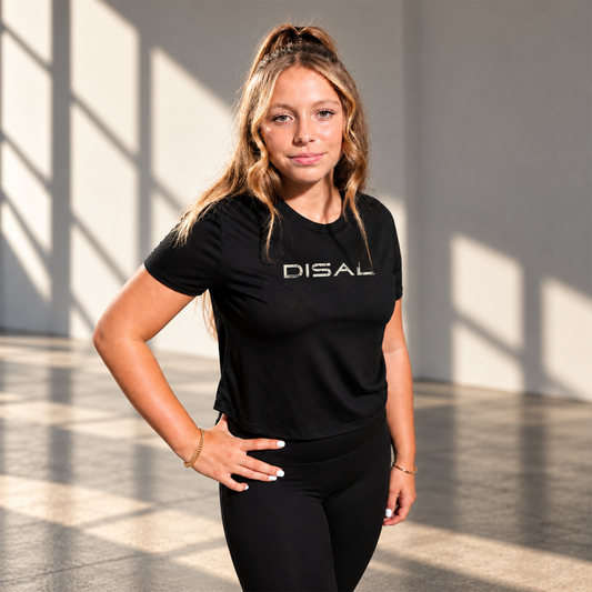 Model wearing black tee with ivory logo