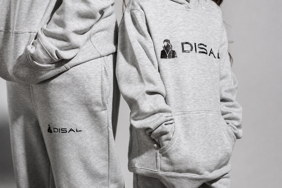 Two models wearing gray DISAL sweatshirts